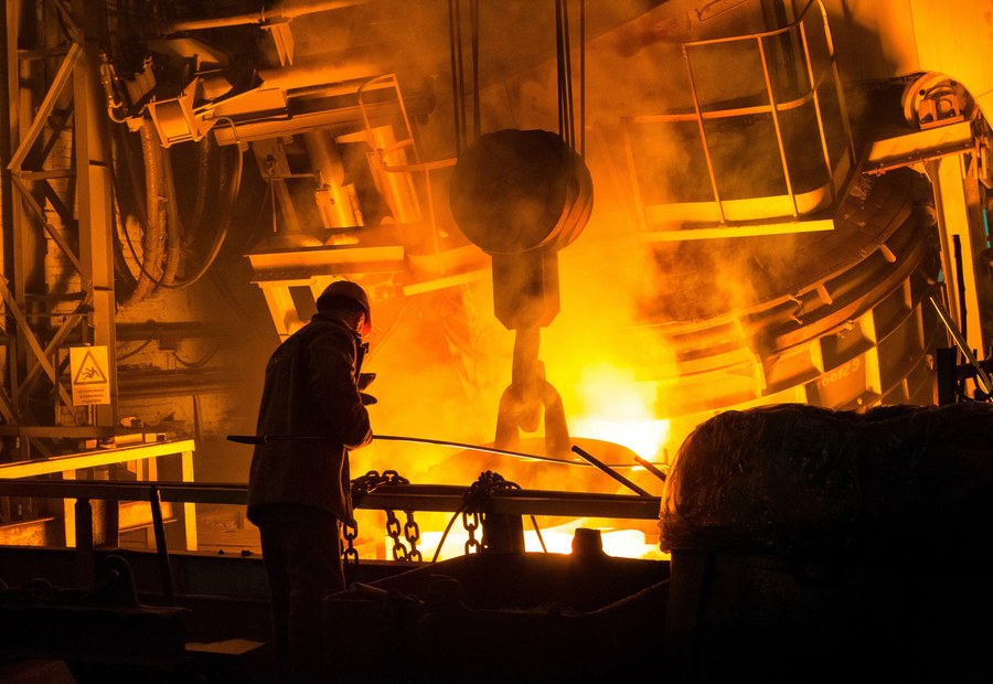 Molten metal being poured during the induction furnace casting process at MTI's foundry