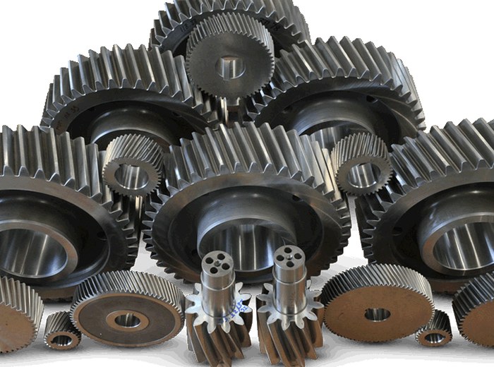Stack of precision-machined steel gears manufactured by MTI
